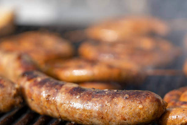 istock Sausages Cooking Over The Hot Coals on Barbecue Grill 1131529603