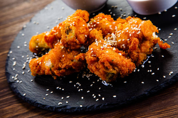 istock Fried chicken nuggets and vegetables 1131534261