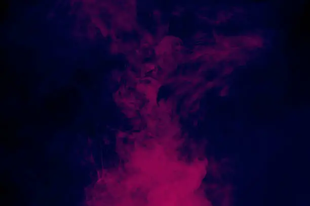 Photo of Smoke colorful background. Neon colors explosion.