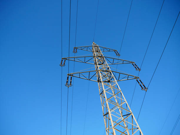 istock High Voltage Power Pylon and Blue Sky in the Countryside 1131536088