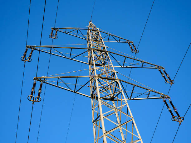 istock High Voltage Power Pylon and Blue Sky in the Countryside 1131536613