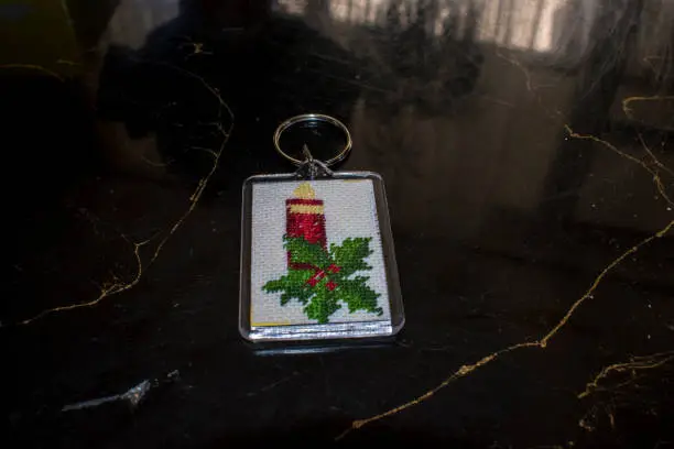 Photo of Small key chain with embroidered Christmas motives.