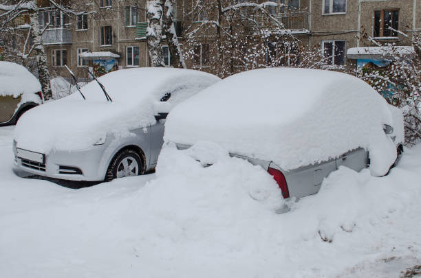 istock cars under snowdrifts after snowfall 1131538216