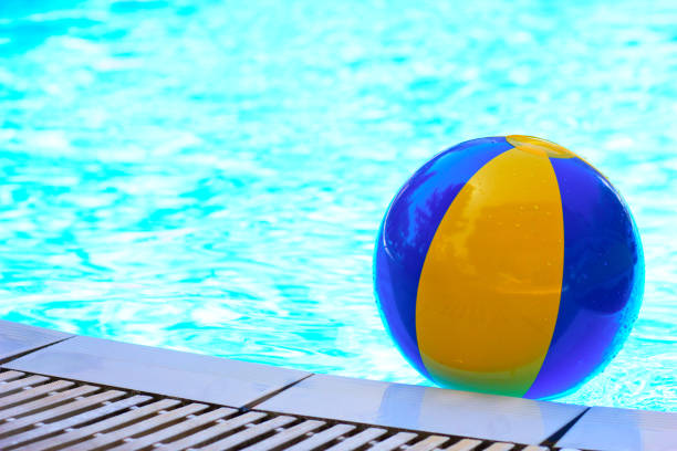 istock Blue yellow inflatable ball in the swimming pool 1131538965