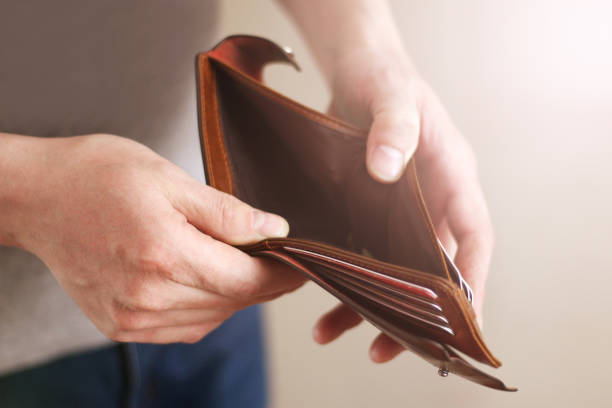 istock Empty wallet in the hands of an elderly man. Business concept. 1131541288