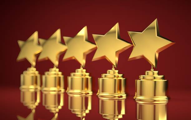 istock Five golden rating star in red background. 1131542732