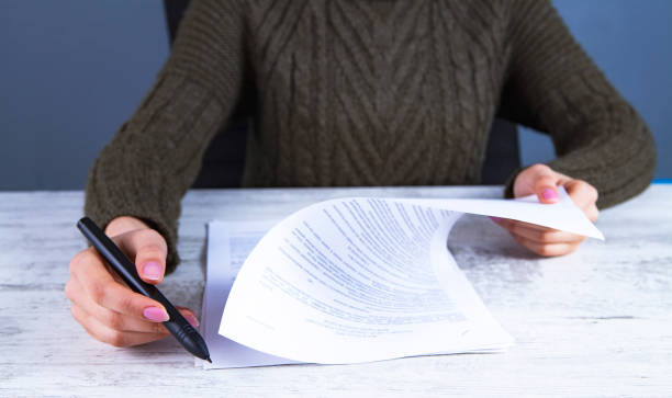 istock businesswoman and documents 1131543583