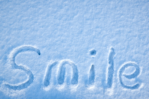 smile inscription in the snow