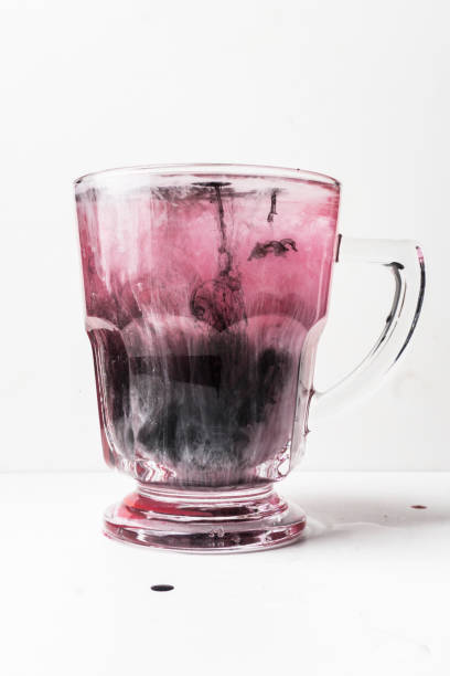 istock Pink and black ink drop water 1131546824