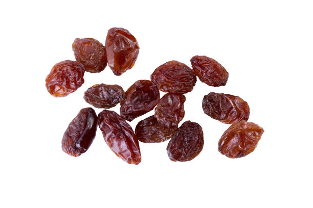 istock Dried raisins on white. Fruit food background. 1131547462