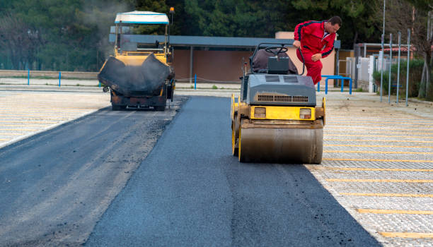 istock Worker leads the vibrating road roller to compact the asphalt laid out for the construction of a road 1131548294