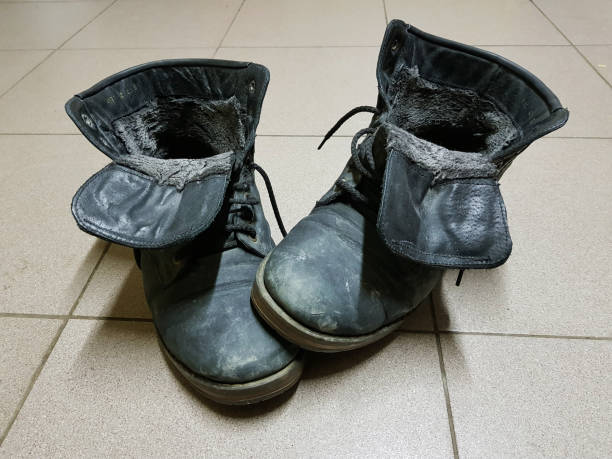 istock old boots or old boots on the floor 1131550169