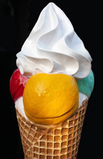 istock Vanilla ice cream with balls on black background 1131550444