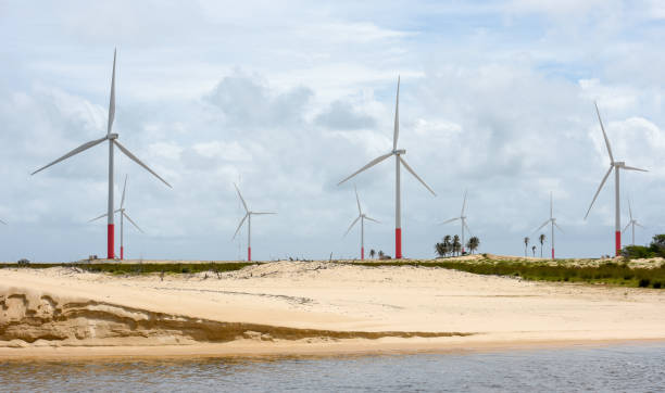 Windmills on the sand dunes of Lencois Maranhenses near Atins on Brazil stock photo