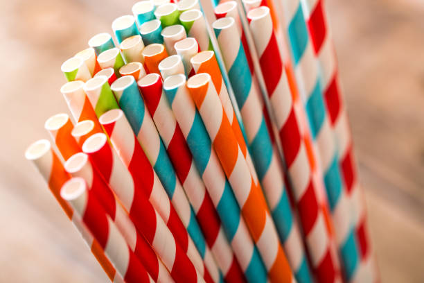 Eco friendly Stripped paper straws Striped paper straws in glass drinking straw stock pictures, royalty-free photos & images