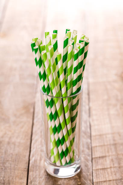 istock Stripped paper drink straws in glass. 1131562253