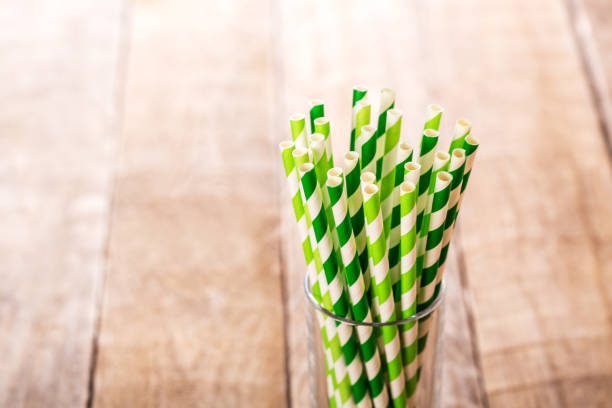 istock Stripped paper drink straws in glass. 1131562265