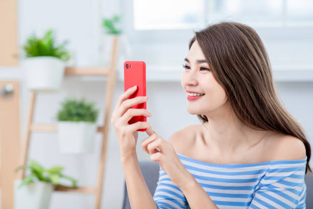 istock pretty woman use smartphone 1131563224