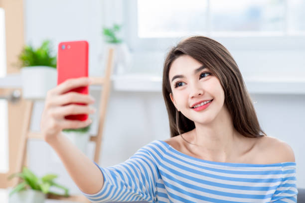 istock woman selfie happy 1131563242
