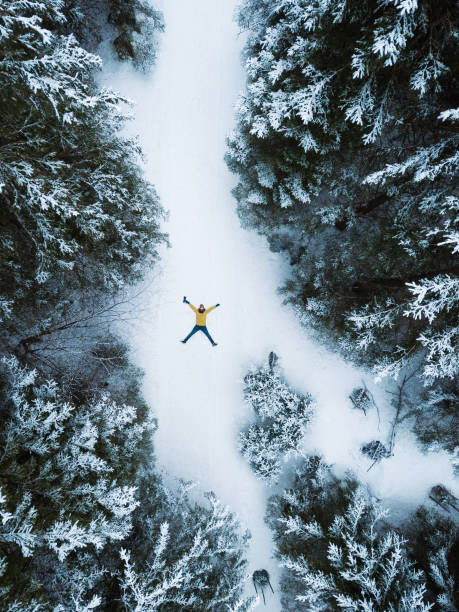 istock The lying man in winter forest 1131563419