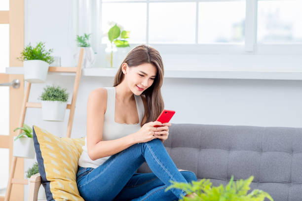 istock pretty woman use smartphone 1131563502