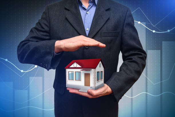 istock House in the hands of men. Property security. 1131565016