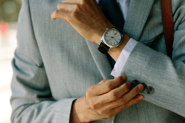 istock Business man buttoning up his blazer sleeves 1131566231