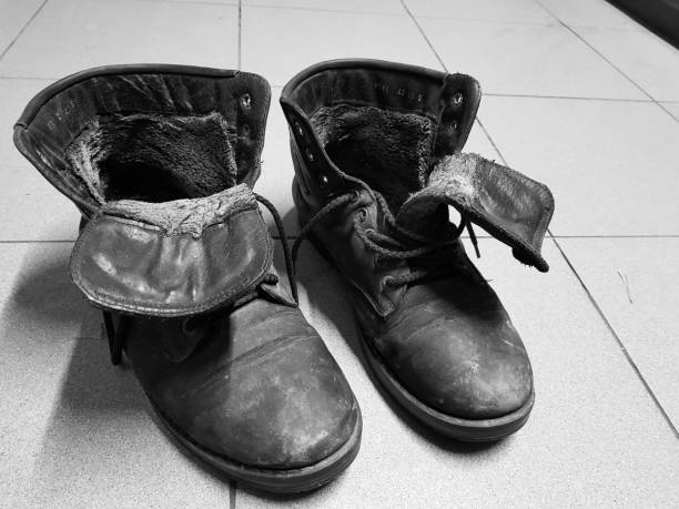 istock old boots or old boots on the floor 1131566302