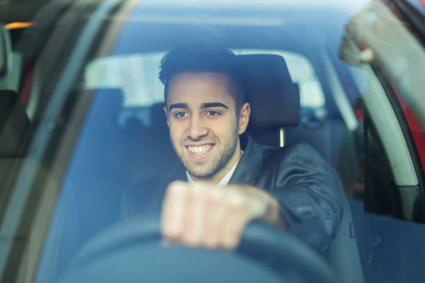 istock Young businessman driving a car 1131571210