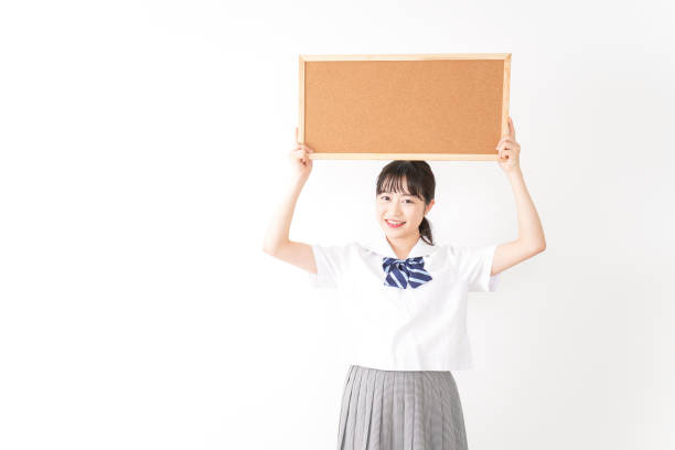 istock Young woman holding a board 1131571773
