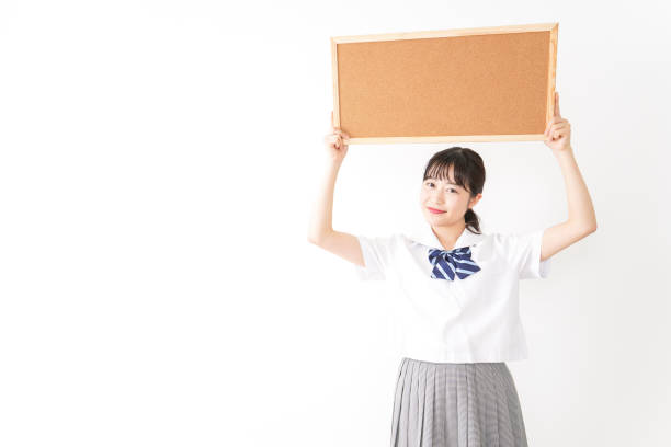istock Young woman holding a board 1131571775