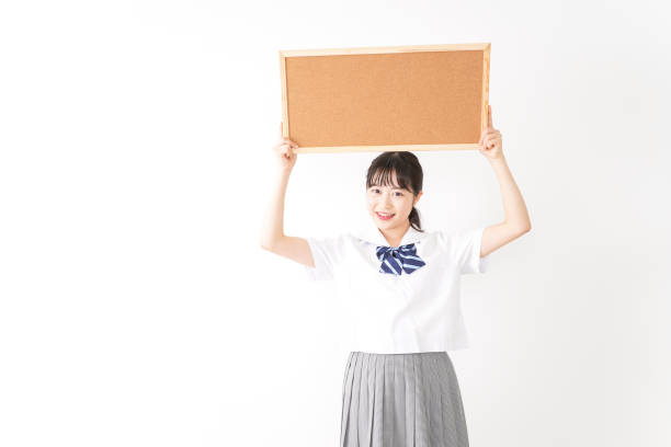 istock Young woman holding a board 1131571785