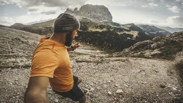 Man trail running on Dolomites high mountain