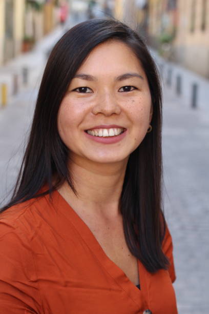istock Cute Asian woman with cheerful expression 1131573013
