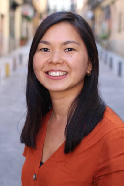 istock Asian woman smiling outdoors headshot 1131573029