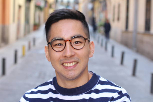 istock Handsome Asian man smiling outdoors 1131573077