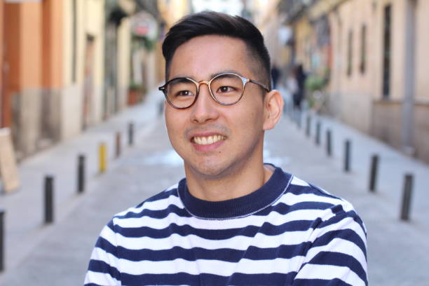 istock Young cute Asian man smiling outdoors 1131573078