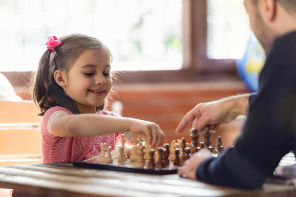 istock Father Teaching His Daughter to Play Chess At Home 1131573202