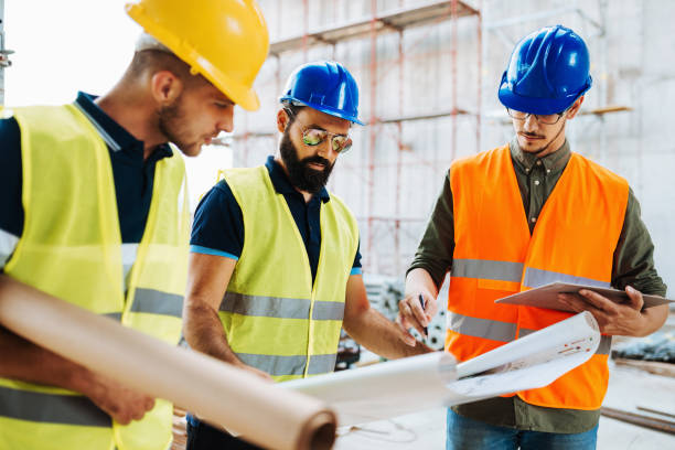 istock Construction industry - architects and engineers working together, leadership in business 1131575181