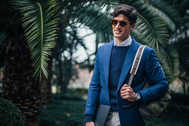 istock Handsome man walking in the park 1131579605