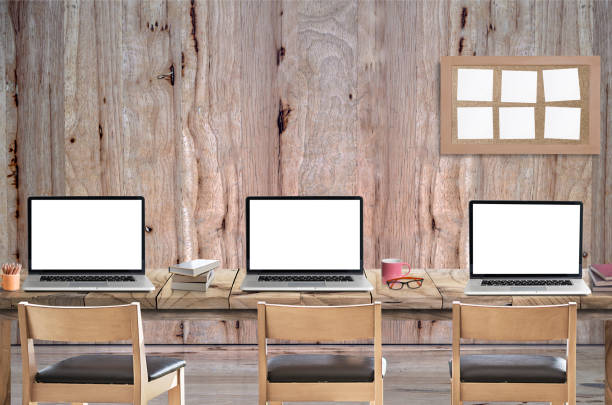 Mockup 3 laptop with blank screen on wooden table, copy space for product display.