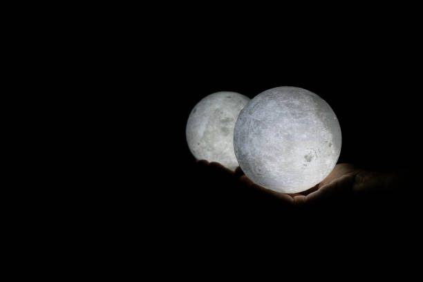 istock close up on moon in hand and reflection 1131580836