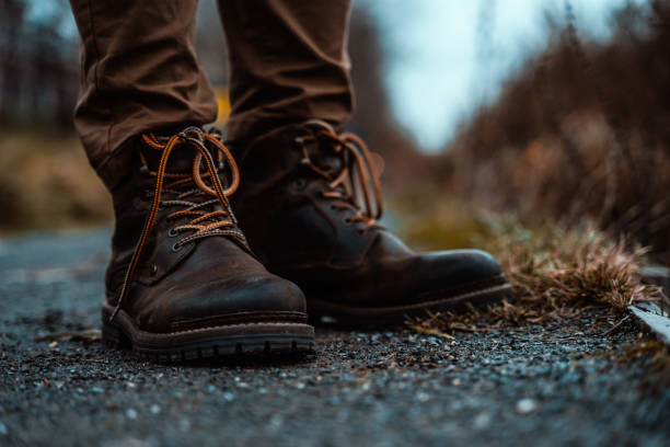 istock Hiking Boots Standing on Gravel Path in Mountains Wilderness Nature 1131581013