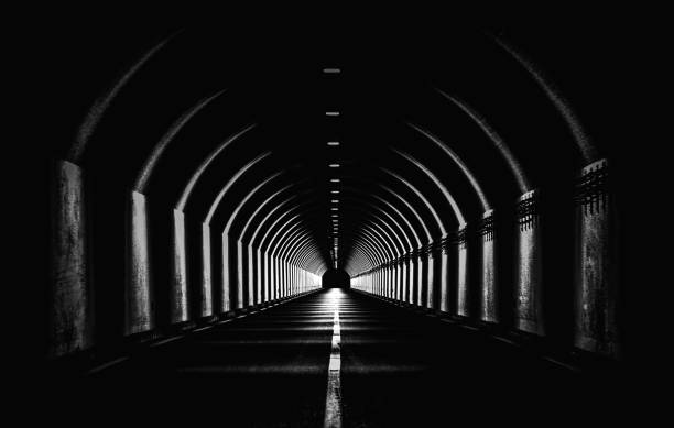 istock Dramatic Black White Monochrome Highway Tunnel Night Time Light Shapes Dark Abstract 1131581055