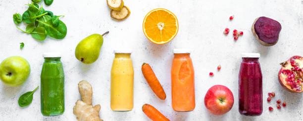 istock Colorful smoothie bottles and ingredients 1131583047