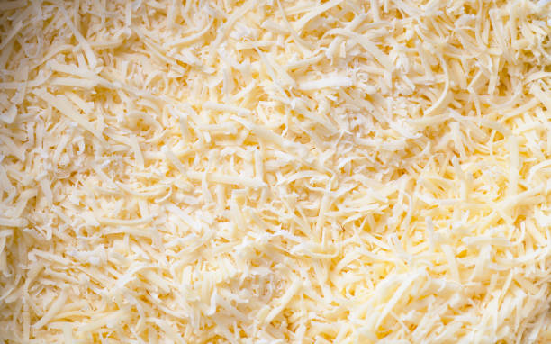 istock Grated cheddar cheese texture for cooking, top view 1131583145