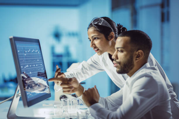 scientists working in the laboratory, using touch screen - laboratory pharmacy medicine research imagens e fotografias de stock