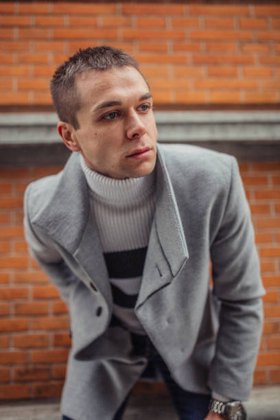 istock Man in gray coat portrait 1131584335