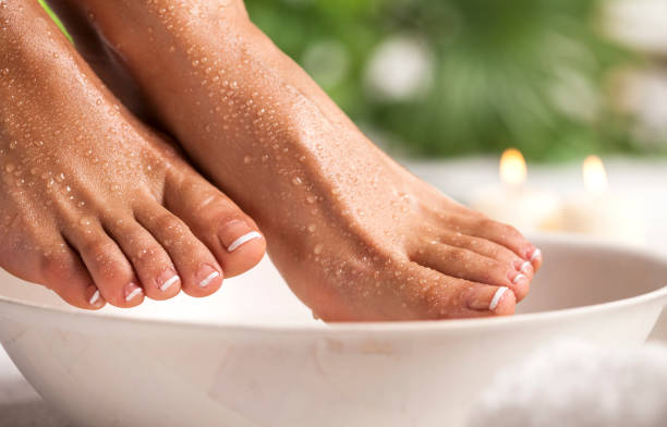 istock Foot spa on a tropical green leaves background 1131585255
