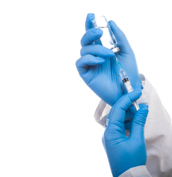 istock A syringe and a bottle with an injection solution on white background. 1131585825